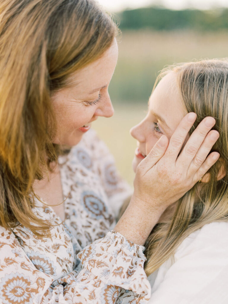 Mother and Daughter looking at each other during maine family session