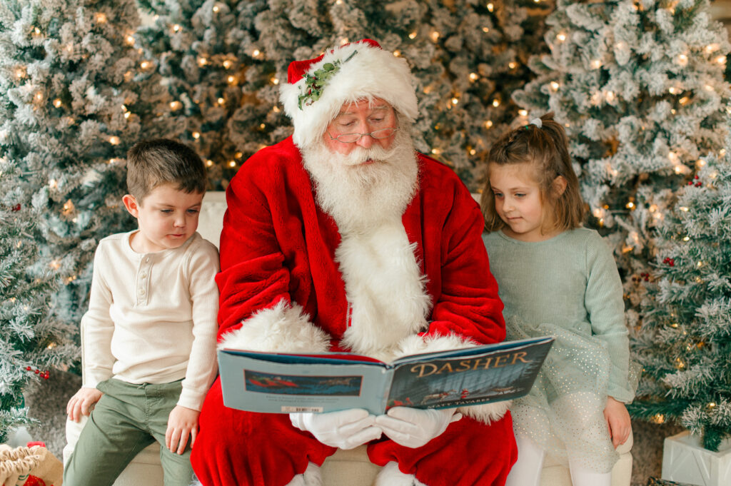 Santa reading a special book to the children